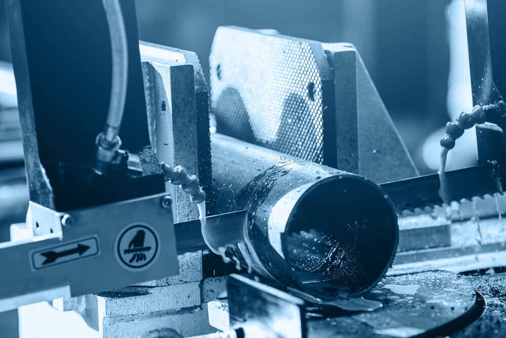 metal-cutting band saw cutting metal pipe