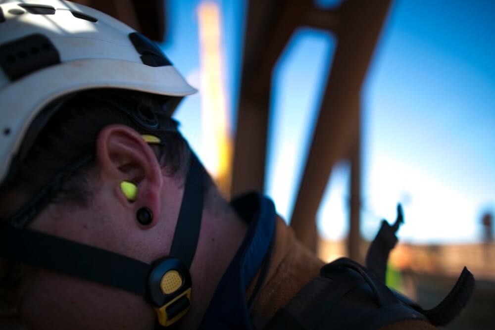 Earplug worker wearing a ear plug noise safety protection